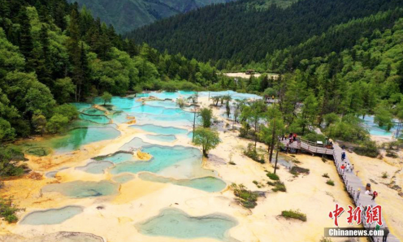 Enchanting scenery of Huanglong Scenic and Historic Interest Area in Songpan County, southwest China's Sichuan Province, June 19, 2023. (Photo: China News Service/An Yuan) Famous for its colorful water pools, snow mountains, deep valleys and forests, Huanglong was listed as one of UNESCO world heritage sites in 1992, becoming a popular tourist attraction.