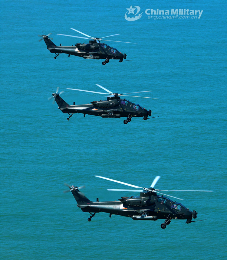 Three attack helicopters attached to an army brigade under the PLA Eastern Theater Command fly in formation over the sea during a flight training exercise on June 9, 2023. (eng.chinamil.com.cn/Photo by Zhang Huanpeng)