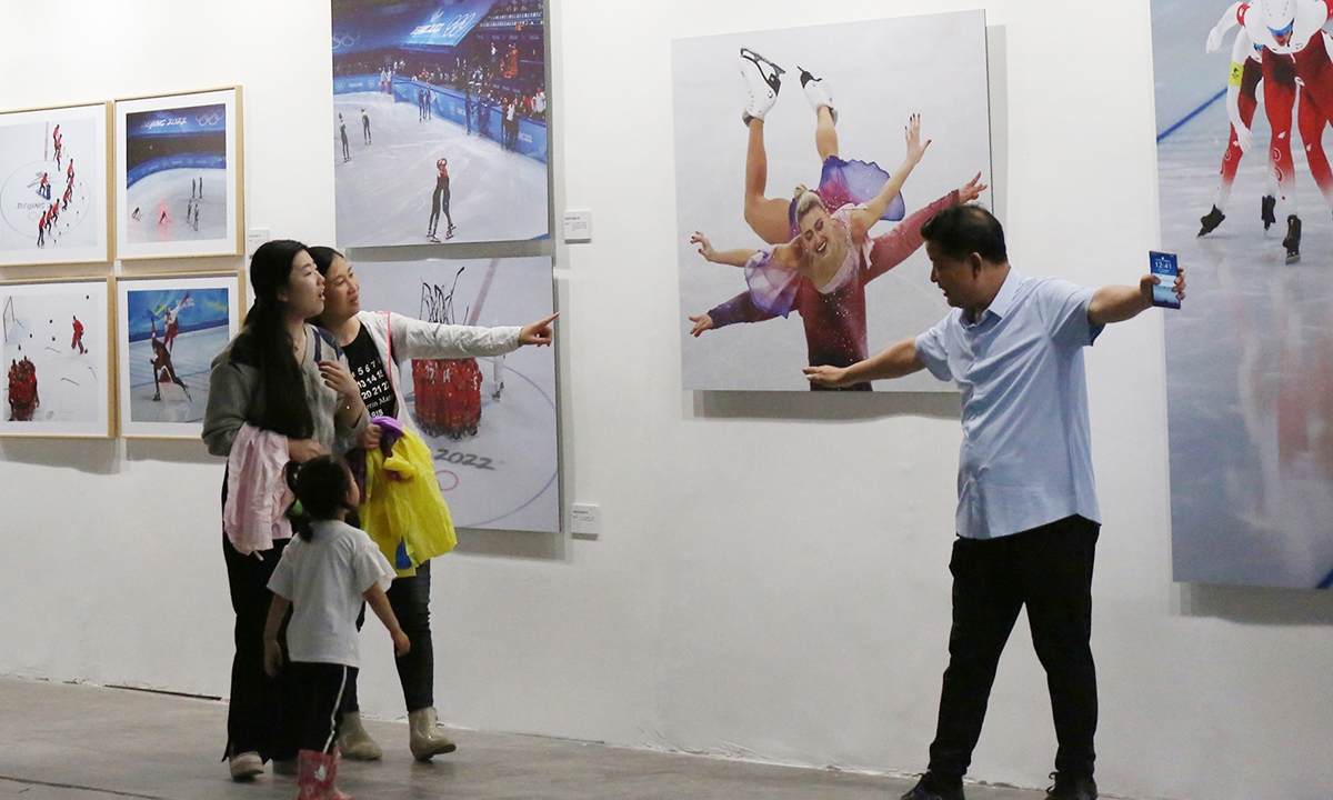 Visitors explore the exhibition. Photo: Courtesy of China Photographers Association 