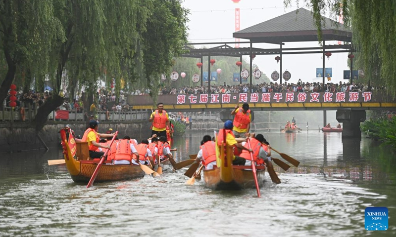 Villagers participate in a dragon boat race to mark the upcoming traditional Chinese Dragon Boat Festival, in Mindang Village of Hefu Town, Huzhou City, east China's Zhejiang Province, June 18, 2023. Dragon Boat Festival, also known as Duanwu Festival, is a traditional holiday in China. It is celebrated on the fifth day of the fifth month of the Chinese lunar calendar. (Xinhua/Huang Zongzhi)