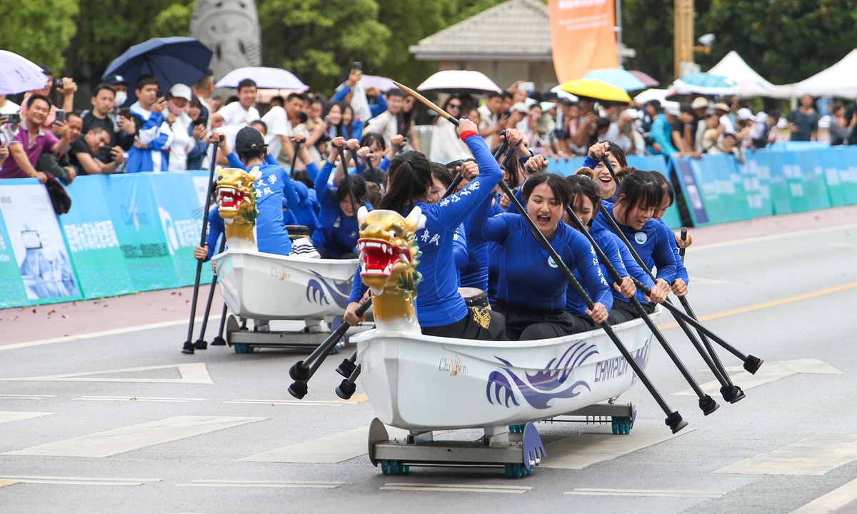 College students participate in a dragon boat competition which uses the land-based 