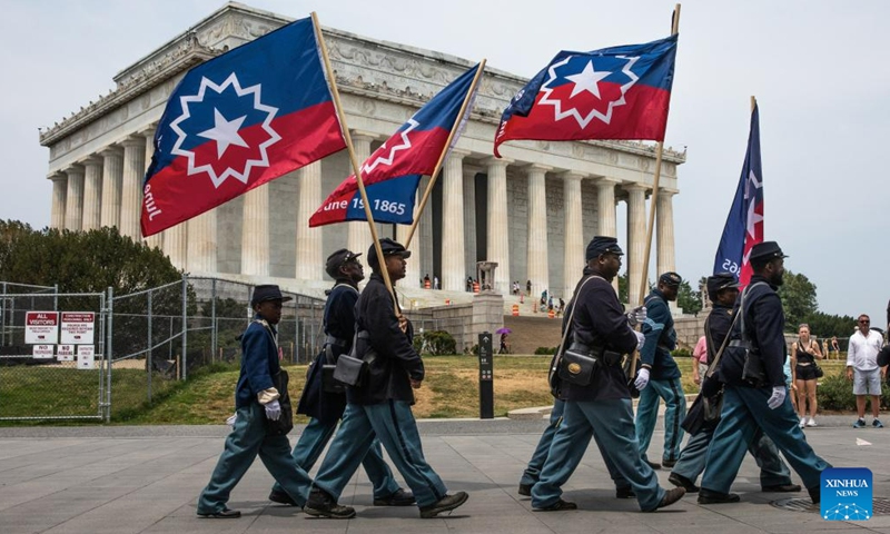 Members of a Civil War re-enactment troop are seen in front of the Lincoln Memorial during Juneteenth celebrations in Washington, D.C., the United States, on June 19, 2023. Celebrated on June 19, the holiday marks the day in 1865 when Union Major General Gordon Granger issued General Order No. 3 in Galveston, Texas, emancipating the remaining enslaved people in the state.(Photo: Xinhua)