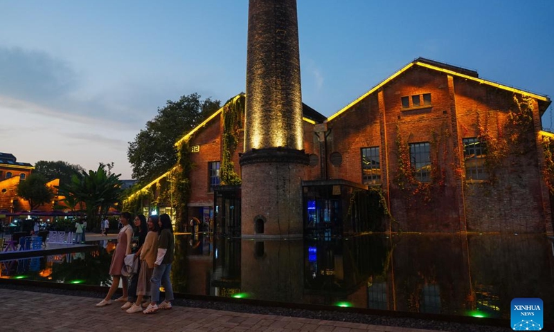 People visit a market on the Taoxichuan ceramic art avenue in Jingdezhen, east China's Jiangxi Province, Oct. 8, 2019. Jingdezhen is a world-famous porcelain capital in east China's Jiangxi Province. The city has four national-level industrial heritage sites. In the past few years, Jingdezhen has advanced the protection and utilization of industrial heritage, injecting new vitality to the city's development.(Photo: Xinhua)