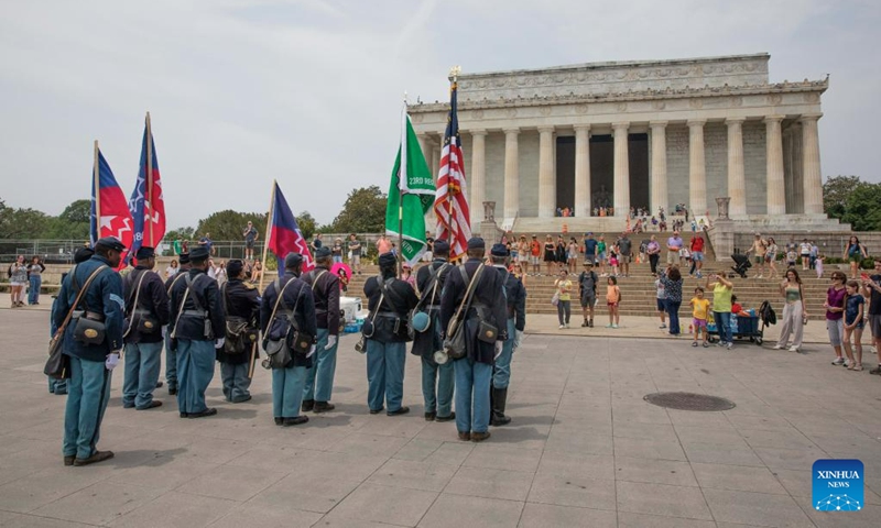 Members of a Civil War re-enactment troop are seen in front of the Lincoln Memorial during Juneteenth celebrations in Washington, D.C., the United States, on June 19, 2023. Celebrated on June 19, the holiday marks the day in 1865 when Union Major General Gordon Granger issued General Order No. 3 in Galveston, Texas, emancipating the remaining enslaved people in the state.(Photo: Xinhua)