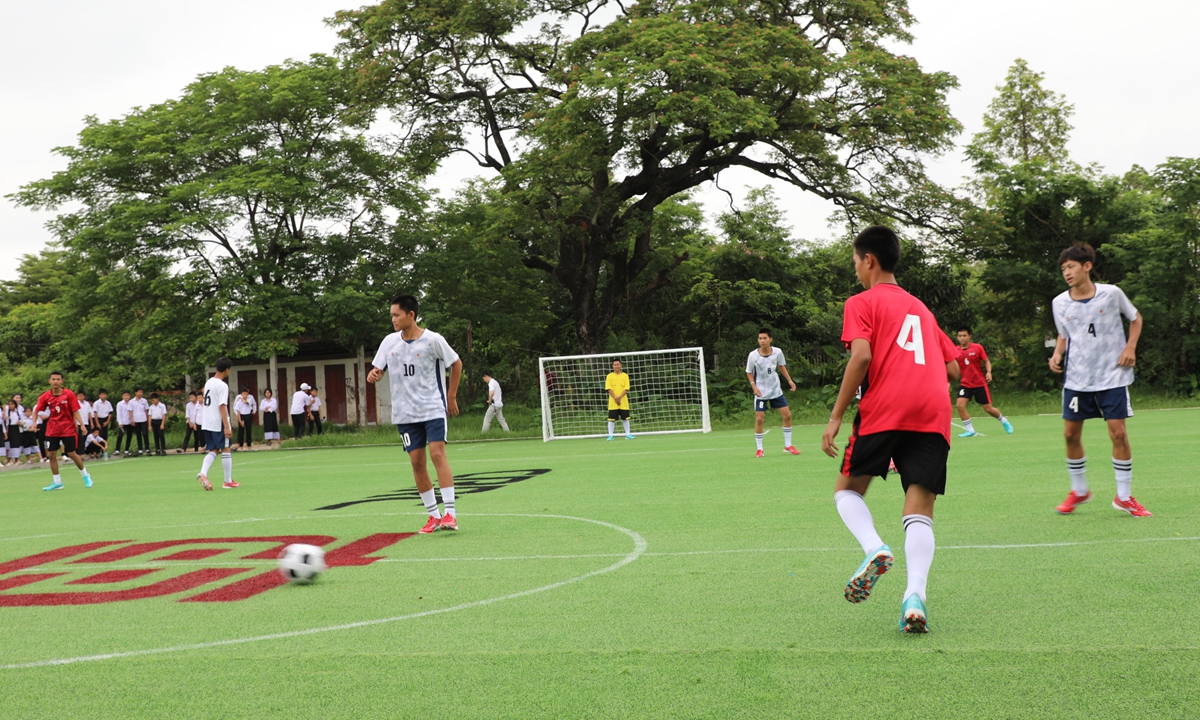 Children play a football match for the event of the 