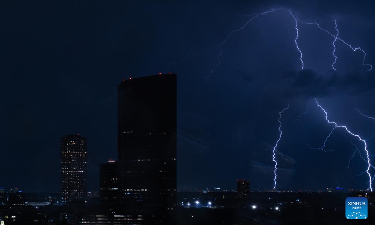 Lightning strikes the sky above the city of Houston, Texas, the United States, June 21, 2023. (Photo by Chen Chen/Xinhua)

