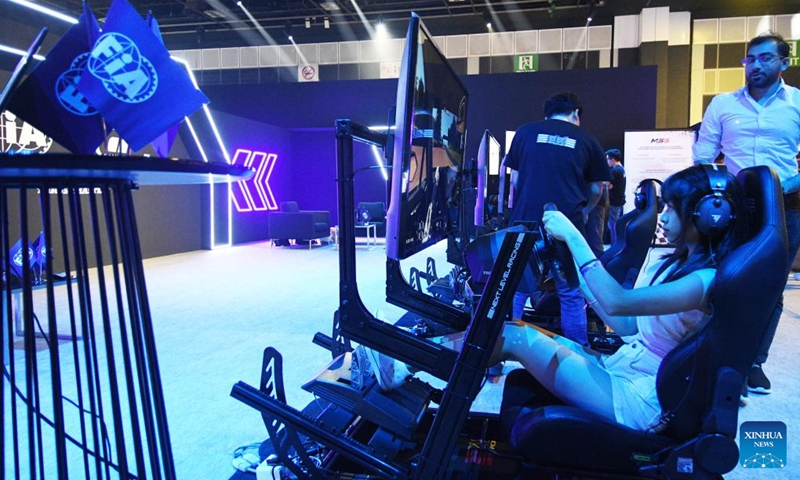 People try out esport games on the first day of competition at the Olympic ESports Week 2023 held in Singapore on June 23, 2023. (Photo by Then Chih Wey/Xinhua)