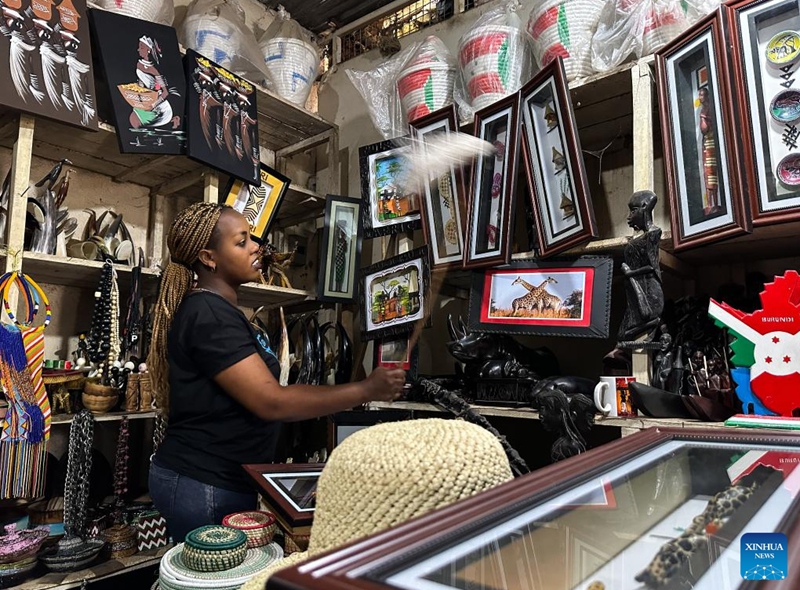 A handicraft merchant is seen at her store in Bujumbura, Burundi, June 22, 2023. Bujumbura is economic capital, the largest city and main port of Burundi. (Xinhua/Han Xu)