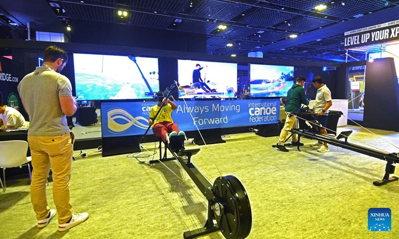 People try out esport games on the first day of competition at the Olympic ESports Week 2023 held in Singapore on June 23, 2023. (Photo by Then Chih Wey/Xinhua)