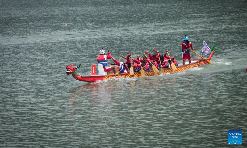 Members of a dragon boat racing team compete during a Nepal-China friendship dragon boat race festival in Pokhara, Nepal, on June 23, 2023. (Photo by Hari Maharjan/Xinhua)