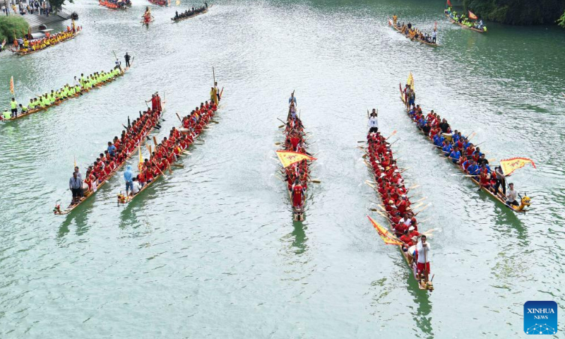 People participate in a dragon boat race in Bijiang district of Tongren, Southwest China's Guizhou Province, June 17, 2023. Photo: Xinhua