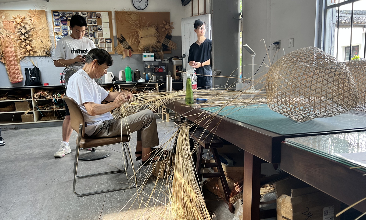 Craftsmen work on bamboo weaving handicrafts in Wuzhen, East China's Zhejiang Province.  Photo: Pang Yue/Global Times