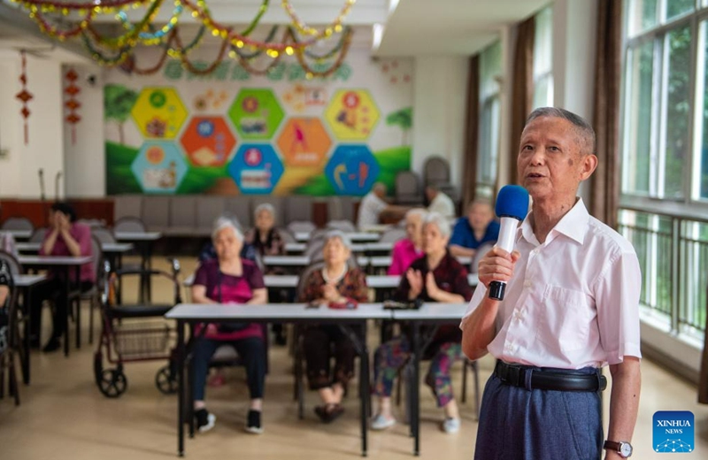 A senior resident sings at a social welfare center in Hanshou County of Changde City, central China's Hunan Province, June 20, 2023. The city of Changde has scaled up efforts to develop an elderly care service system composed mainly of in-home cares, community services, institutional and medical cares. (Xinhua/Chen Sihan)