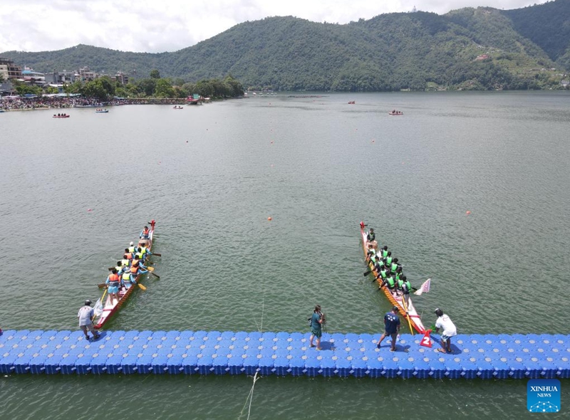 Members of dragon boat racing teams are ready to compete during a Nepal-China friendship dragon boat race festival in Pokhara, Nepal, on June 23, 2023. (Photo by Hari Maharjan/Xinhua)