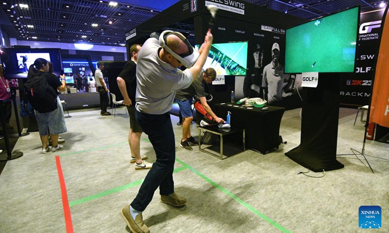 People try out esport games on the first day of competition at the Olympic ESports Week 2023 held in Singapore on June 23, 2023. (Photo by Then Chih Wey/Xinhua)