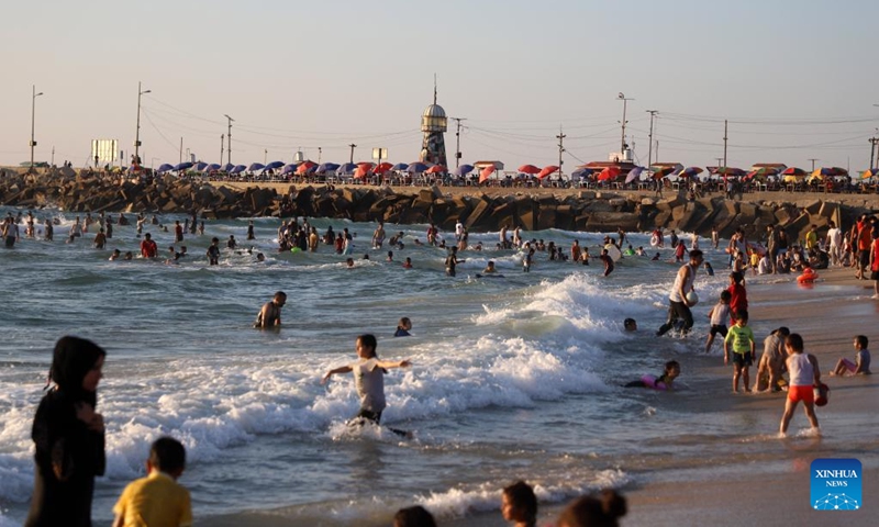 People cool off at the beach of the Mediterranean sea amid a heatwave in Gaza City, on June 23, 2023. (Photo by Rizek Abdeljawad/Xinhua)