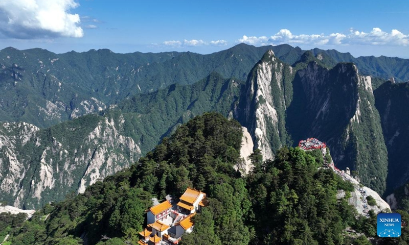 This aerial photo taken on June 23, 2023 shows visitors on the Huashan Mountain in Weinan, northwest China's Shaanxi Province. (Photo by Zhang Lan/Xinhua)