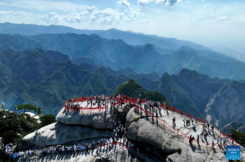 This aerial photo taken on June 23, 2023 shows visitors on the Huashan Mountain in Weinan, northwest China's Shaanxi Province. (Photo by Zhang Lan/Xinhua)