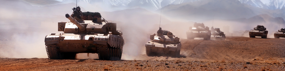 Main battle tanks attached to a brigade under the PLA 77th Group Army kick up plumes of dust as they move forward to the designated base during a maneuver operation in desert on June 7, 2023. (eng.chinamil.com.cn/Photo by Peng Jiazheng)