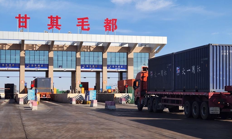 This photo taken on June 21, 2023 shows cargo trucks being inspected at Ganqmod Port in the city of Bayannur, north China's Inner Mongolia Autonomous Region. The daily volume of goods handled by Ganqmod Port, the largest highway port on the China-Mongolia border, has surpassed 170,000 tonnes so far this year, the port administration said Thursday.(Xinhua/Li Yunping)