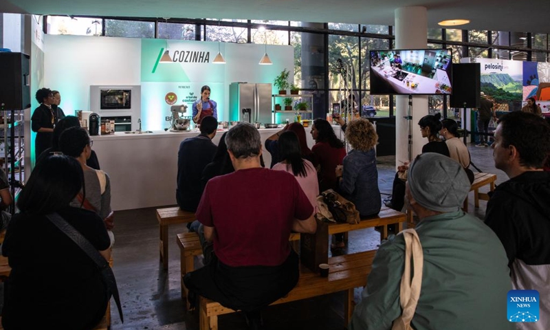 Visitors learn to make coffee during the Sao Paulo Coffee Festival in Sao Paulo, Brazil, on June 23, 2023. (Xinhua/Wang Tiancong)