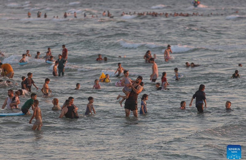 People cool off at the beach of the Mediterranean sea amid a heatwave in Gaza City, on June 23, 2023. (Photo by Rizek Abdeljawad/Xinhua)