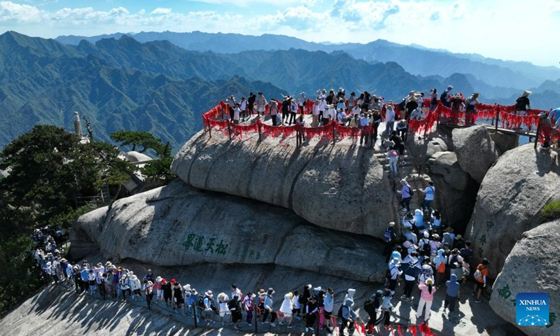 This aerial photo taken on June 23, 2023 shows visitors on the Huashan Mountain in Weinan, northwest China's Shaanxi Province. (Photo by Zhang Lan/Xinhua)