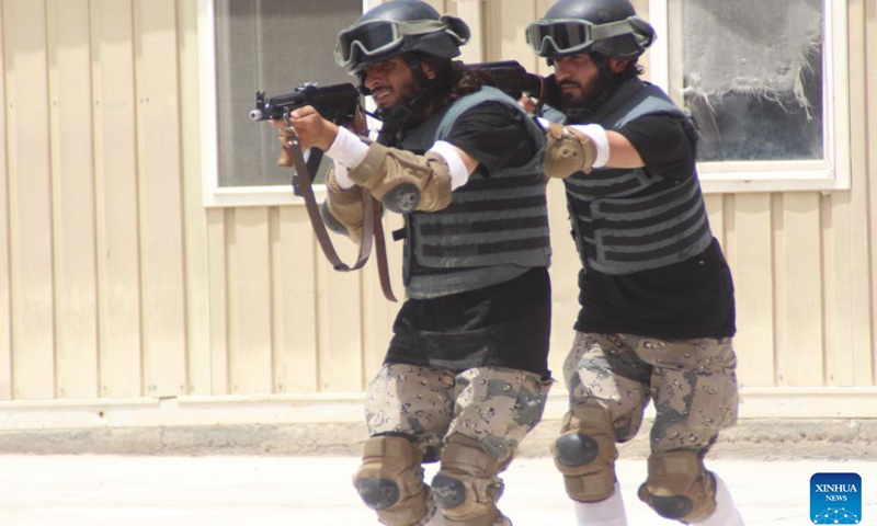 Police cadets show their shooting skills during their graduation ceremony in Nangarhar Province, Afghanistan, June 24, 2023. A total of 430 newly graduated cadets have joined Afghanistan's national police force after completing a two-month training course in the eastern Nangarhar province, Qari Basharmal Bashardost, National Police Academy commander in the east, said Saturday.(Photo: Xinhua)