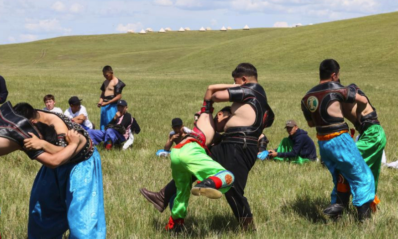 Young contestants prepare for a Mongolian wrestling competition in Hulun Buir, north China's Inner Mongolia Autonomous Region, July 1, 2023. The second edition of the Hulun Buir grassland culture and tourism festival kicked off here on Saturday, attracting nationwide tourists with various performances of folk culture. (Xinhua/Lan Hongguang)