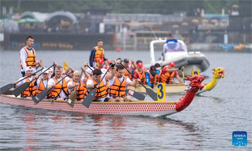 Participants compete during dragon boat race in Vladivostok, Russia ...