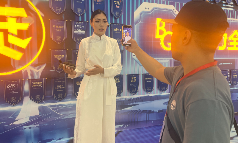 Mongolian reporter Otgontuya from Bolod.mn introduces Chinese e-commerce service provider Shanghai Buy Quickly BMax Technology Services Group Co., Ltd to people in Mongolia on June 27, 2023. Photo: Du Qiongfang/GT