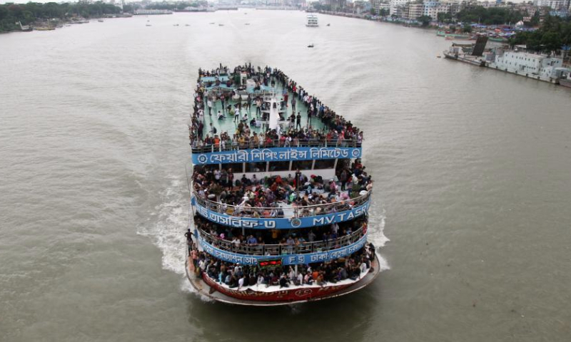 People are seen on a ferry near Sadarghat terminal ahead of Eid al-Adha in Dhaka, Bangladesh, on June 27, 2023. As Eid al-Adha approaches, many people from Dhaka have streamed out of the city to join the festival with their kith and kin in village homes. (Xinhua)