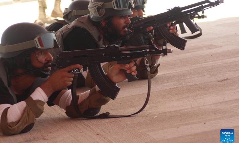 Police cadets show their shooting skills during their graduation ceremony in Nangarhar Province, Afghanistan, June 24, 2023. A total of 430 newly graduated cadets have joined Afghanistan's national police force after completing a two-month training course in the eastern Nangarhar province, Qari Basharmal Bashardost, National Police Academy commander in the east, said Saturday(Photo: Xinhua)