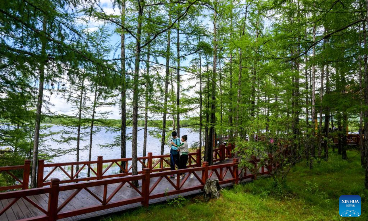 This aerial photo taken on July 6, 2023 shows tourists enjoying themselves at the Arxan National Forest Park in Arxan of Hinggan League, north China's Inner Mongolia Autonomous Region. Photo:Xinhua