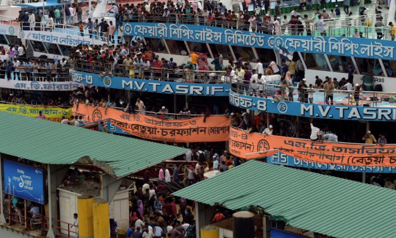 People are seen at Sadarghat terminal ahead of Eid al-Adha in Dhaka, Bangladesh, on June 27, 2023. As Eid al-Adha approaches, many people from Dhaka have streamed out of the city to join the festival with their kith and kin in village homes. (Xinhua)