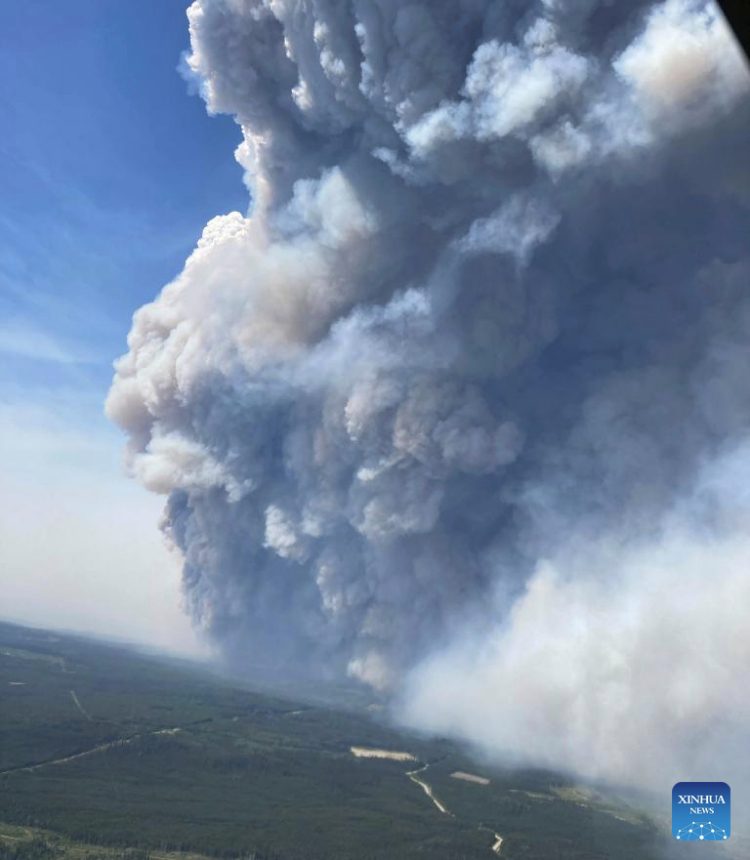 Undated aerial photo provided by BC Wildfire Service shows smoke rising in the Northeast region of British Columbia, Canada. Canada is seeing its worst fire season on record as hundreds of blazes rage across the country, with more than 250 burning out of control, according to the Canadian Interagency Forest Fire Centre. (BC Wildfire Service/Handout via Xinhua)