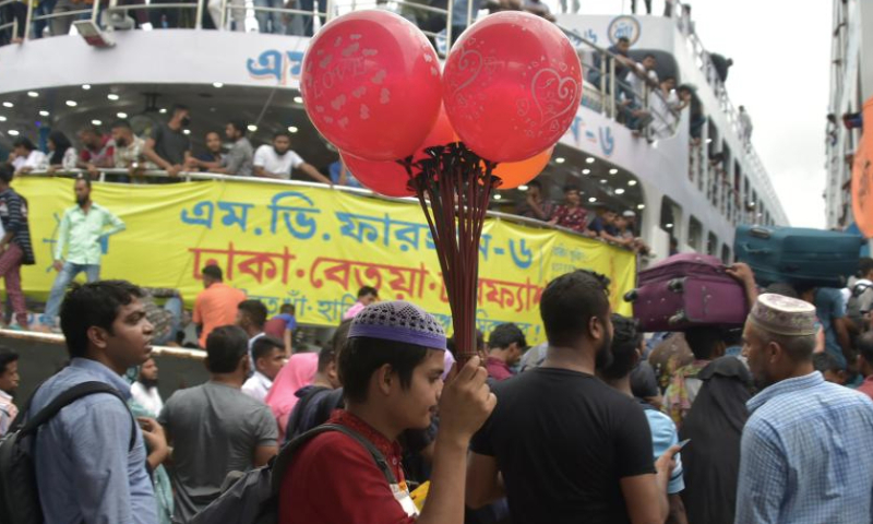 People are seen at Sadarghat terminal ahead of Eid al-Adha in Dhaka, Bangladesh, on June 27, 2023. As Eid al-Adha approaches, many people from Dhaka have streamed out of the city to join the festival with their kith and kin in village homes. (Xinhua)