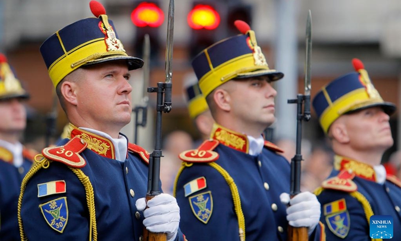 Soldiers stand at attention during a ceremony marking Romania's National Flag Day in Bucharest, capital of Romania, June 26, 2023.(Photo: Xinhua)