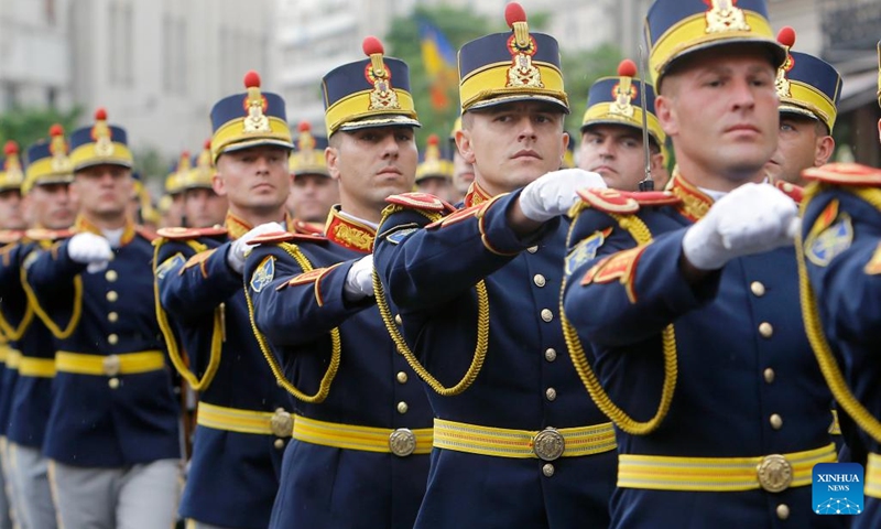 Soldiers march during a ceremony marking Romania's National Flag Day in Bucharest, Romania, on June 26, 2023.(Photo: Xinhua)