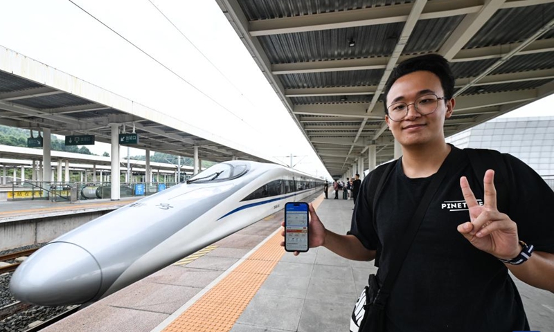 A passenger shows an e-ticket of the high-speed train G2963 in Leshan Station, southwest China's Sichuan Province, July 1, 2023.

The train started on Saturday morning from Chengdu, the capital of southwest China's Sichuan Province, heading for Hong Kong.

It marked the opening of a direct high-speed train service between Chengdu and Hong Kong. (Xinhua/Wang Xi)