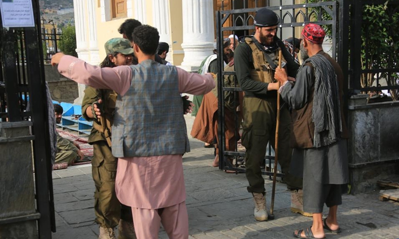 Security officials frisk people in front of a mosque in Kabul, capital of Afghanistan, on June 28, 2023. Afghans celebrated Eid al-Adha on Wednesday, one of the largest annual religious festivals observed by Muslims worldwide, amid tight security. (Photo: Xinhua)