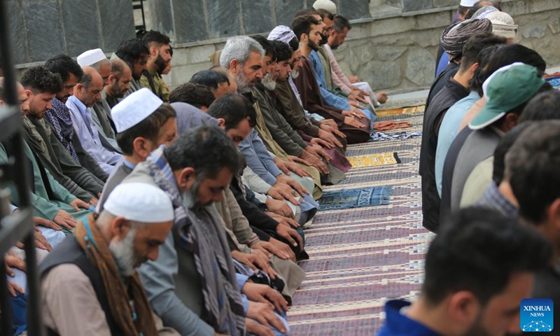 People pray during Eid al-Adha in Kabul, capital of Afghanistan, on June 28, 2023. Afghans celebrated Eid al-Adha on Wednesday, one of the largest annual religious festivals observed by Muslims worldwide, amid tight security. (Photo: Xinhua)