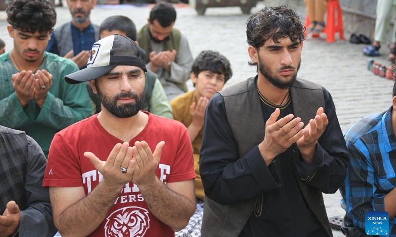 People pray during Eid al-Adha in Kabul, capital of Afghanistan, on June 28, 2023. Afghans celebrated Eid al-Adha on Wednesday, one of the largest annual religious festivals observed by Muslims worldwide, amid tight security. (Photo: Xinhua)