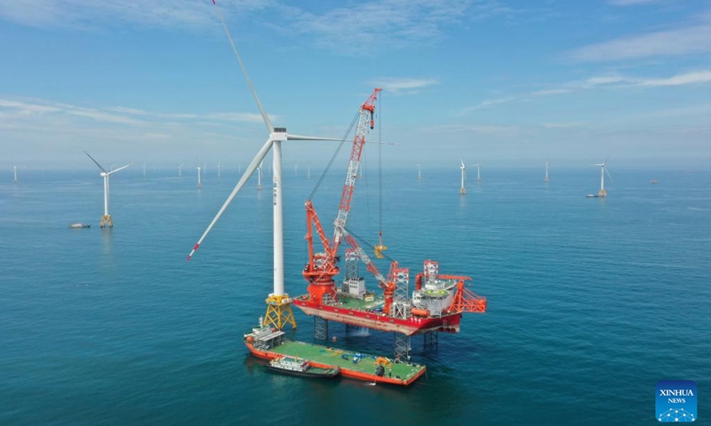 This aerial photo shows the construction site of the world's first 16-megawatt offshore wind turbine in Fuzhou, southeast China's Fujian Province, June 28, 2023. The construction of the giant offshore wind turbine, with the world's largest per-unit capacity, was completed here on Wednesday, according to China Three Gorges Corporation. (Photo:Xinhua)