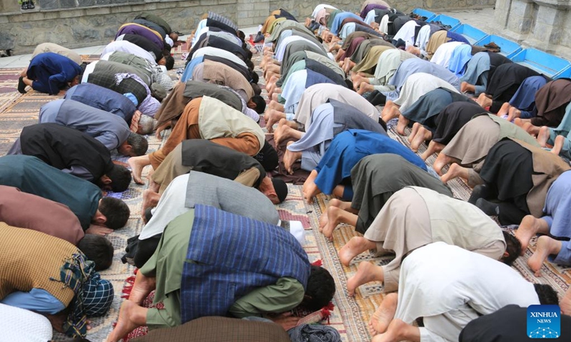 People pray during Eid al-Adha in Kabul, capital of Afghanistan, on June 28, 2023. Afghans celebrated Eid al-Adha on Wednesday, one of the largest annual religious festivals observed by Muslims worldwide, amid tight security. (Photo: Xinhua)