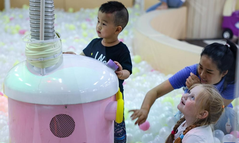 Children visit the fun zone of a shopping mall in Hunchun, northeast China's Jilin Province, June 27, 2023. Hunchun, a city with about 220,000 residents, is located at China's border with Russia and the Democratic People's Republic of Korea. The resumption of passenger services by the Hunchun customs at the start of 2023 has made it convenient for Russian tourists who visit the city for shopping, entertainment and food experiences. (Photo:Xinhua)