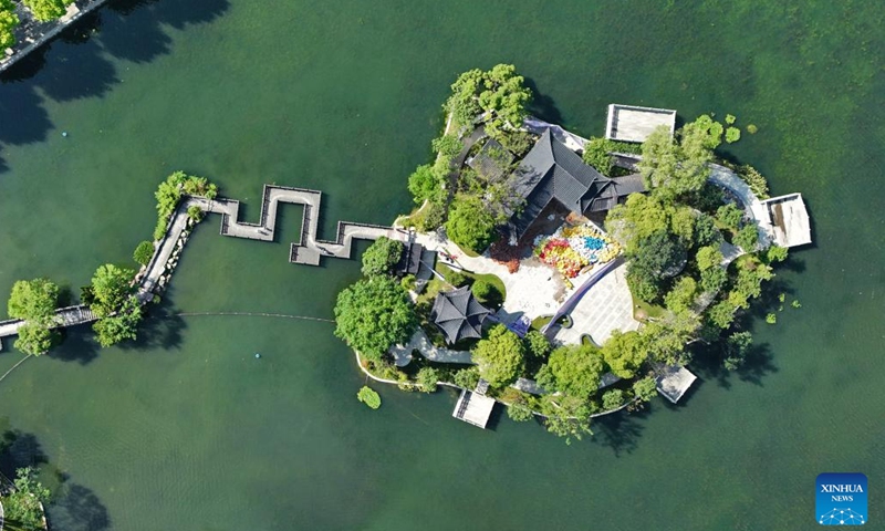 This aerial photo taken on June 28, 2023 shows the Yicui Lake in Jinggangshan, east China's Jiangxi Province. Jinggangshan, which boasts both pristine natural scenery and the cultural heritage of the revolution, has become a famous tourist destination for visitors from home and abroad.(Photo: Xinhua)