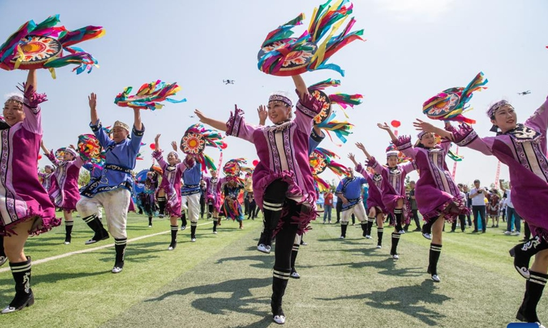 Hezhe people wearing traditional costumes perform during the 11th Wurigong Festival of the Hezhe ethnic group in Fuyuan, northeast China's Heilongjiang Province, July 2, 2023. The festival kicked off in China's easternmost city Fuyuan on Sunday. Members of 15 teams from Beijing, Harbin, Jiamusi, Shuangyashan and other places took part in the event.
 (Xinhua/Zhang Tao)