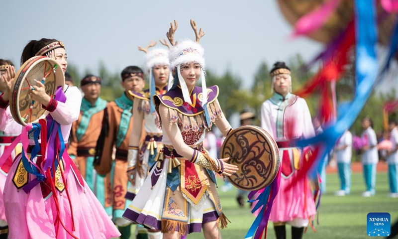 Hezhe people wearing traditional costumes perform during the 11th Wurigong Festival of the Hezhe ethnic group in Fuyuan, northeast China's Heilongjiang Province, July 2, 2023. The festival kicked off in China's easternmost city Fuyuan on Sunday. Members of 15 teams from Beijing, Harbin, Jiamusi, Shuangyashan and other places took part in the event.
 (Xinhua/Zhang Tao)