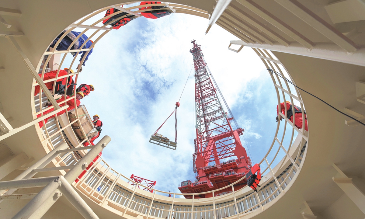 Construction workers work on the conduit frames of the 16-megawatt offshore wind turbine on June 24, 2023. Photo: Xinhua